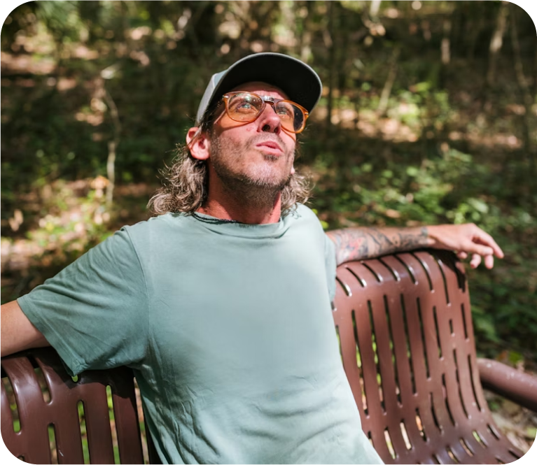man relaxing on a bench